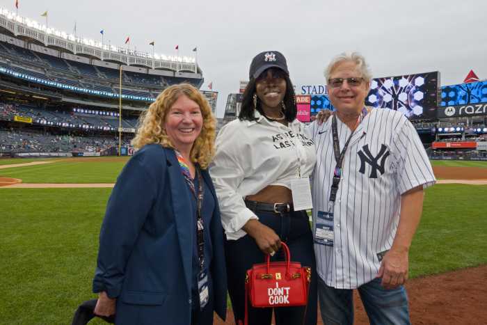 Stonewall Inn co-owners Stacy Lentz, left, and Kurt Kelly, right, with NAACP Image Award nominee, author, host, and creator RaeShanda Lias-Lockhart.