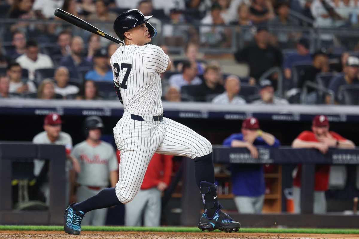 Aaron Judge to be placed on IL with flexor strain: Implications of Yankees’ star’s injury 2 player in white and pinstriped Yankees uniform swings black bat.