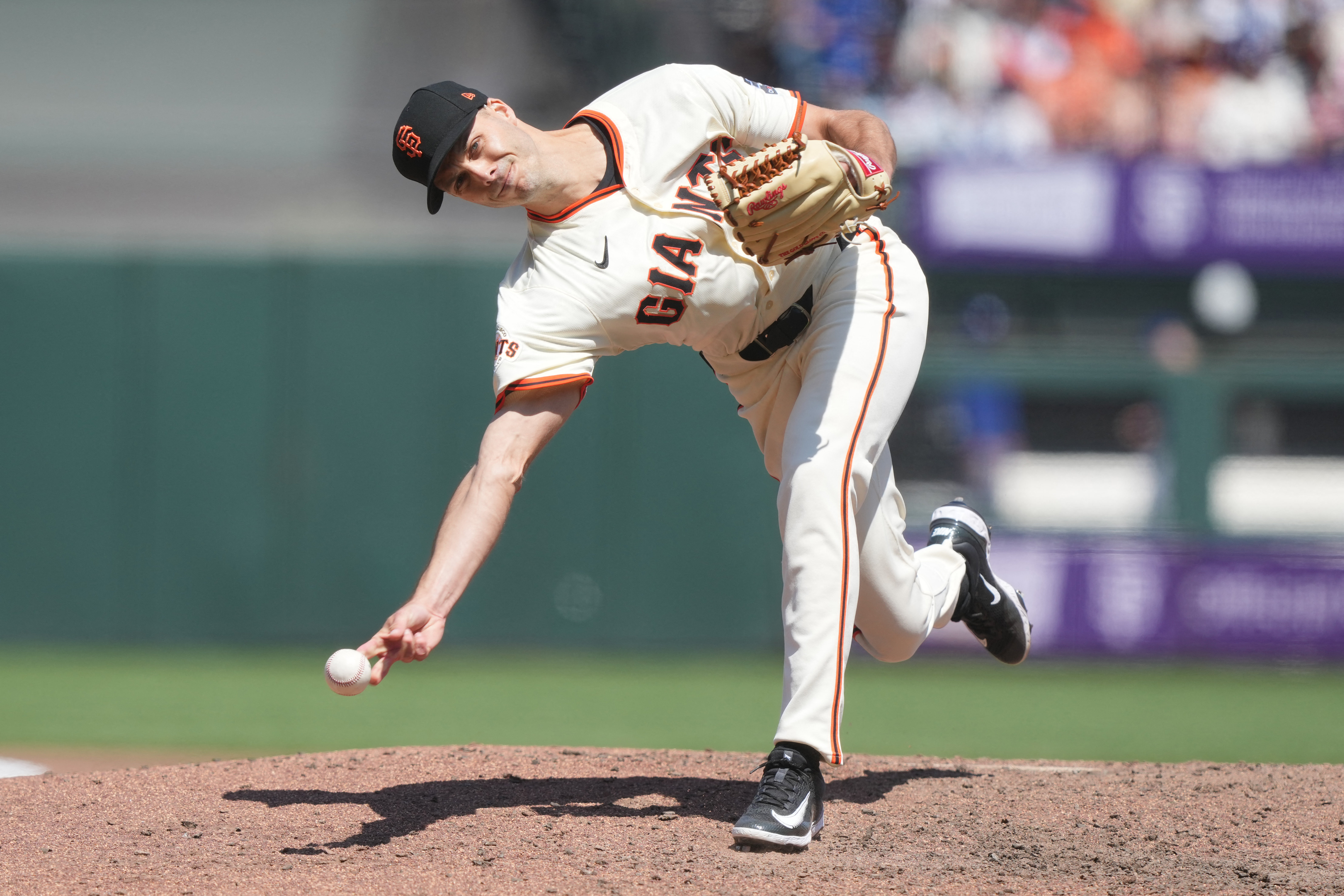 Mets just built one of MLB's best bullpens after Rogers, Helsley trades 4 Tyler Rogers Mets trade: Baseball pitcher in white uniform and black hat delivers pitch submarine style