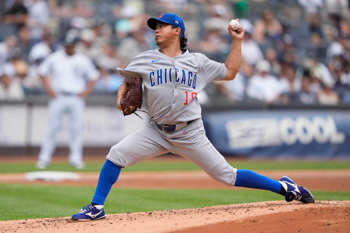 Yankees drop rubber game against Cubs to round out first half of 2025 season 2 man in grey uniform with the word Chicago written in blue throws ball with left hadn