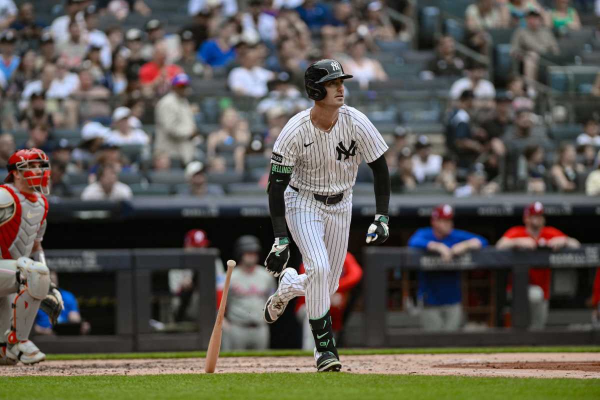 Yankees salvage series finale against Phillies as Ryan McMahon has first big moment in the Bronx 2 Yankee player in white and pinstripe uniforms runs after getting hit