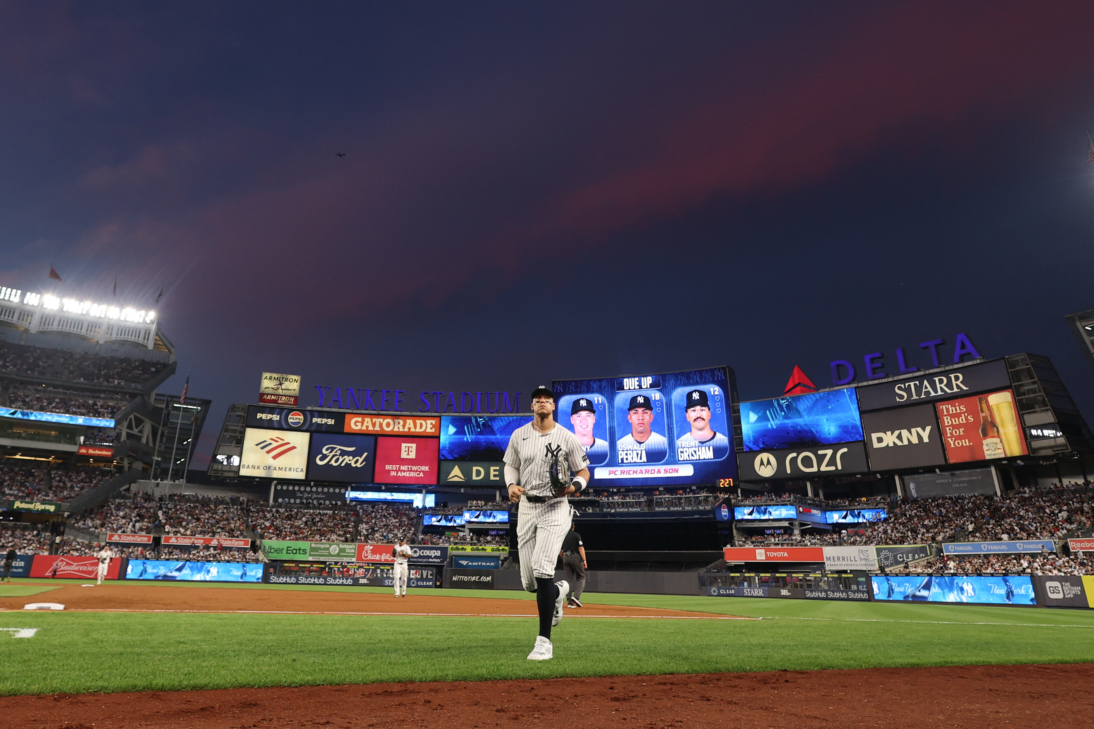 Aaron Judge is back, now the Yankees have to figure it out 2 Aaron Judge injury Yankees: Baseball player in white uniform runs toward dugout