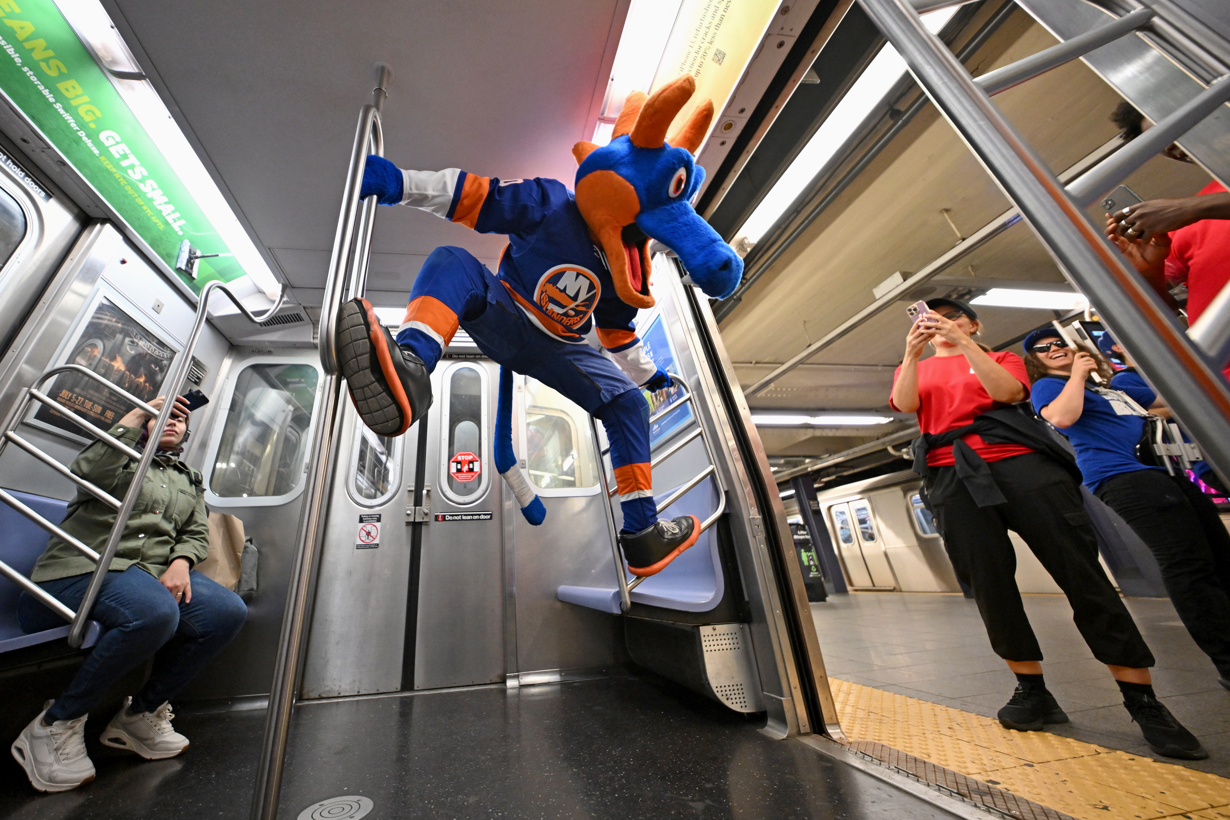 ESPN unveils revamped app with mascot takeover on New York City’s ‘E’ train 3 Sparky the Dragon, mascot for the New York Islanders, and commuters ride the ESPN "E" train celebrating the launch of the all-new ESPN app on August 21, 2025 in New York City.