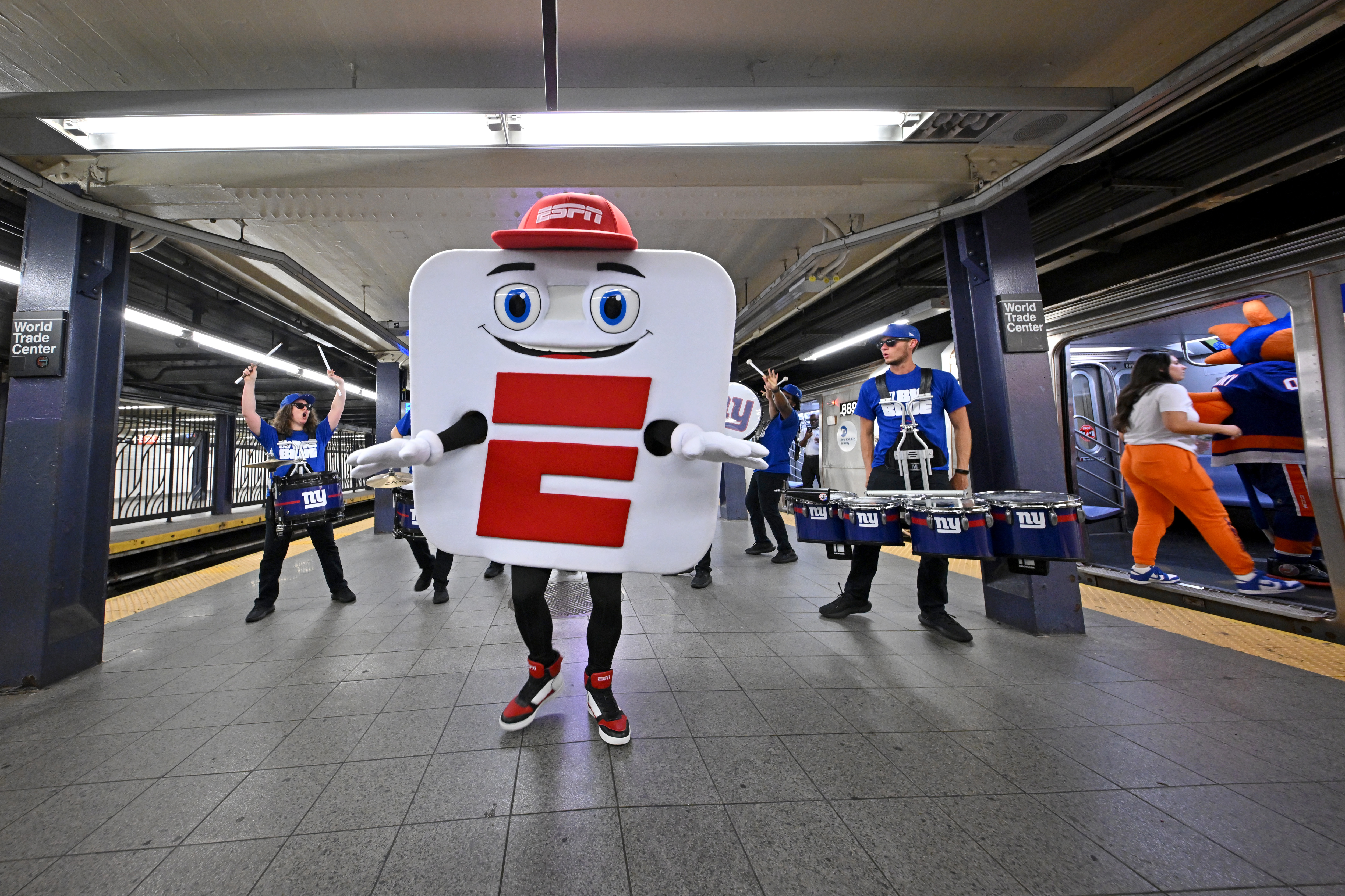 ESPN unveils revamped app with mascot takeover on New York City’s ‘E’ train 4 The New York Giants G-Line drumline, Mascot App-E and ESPN celebrate the launch of the new ESPN app with a "E" train takeover on August 21, 2025 in New York City.