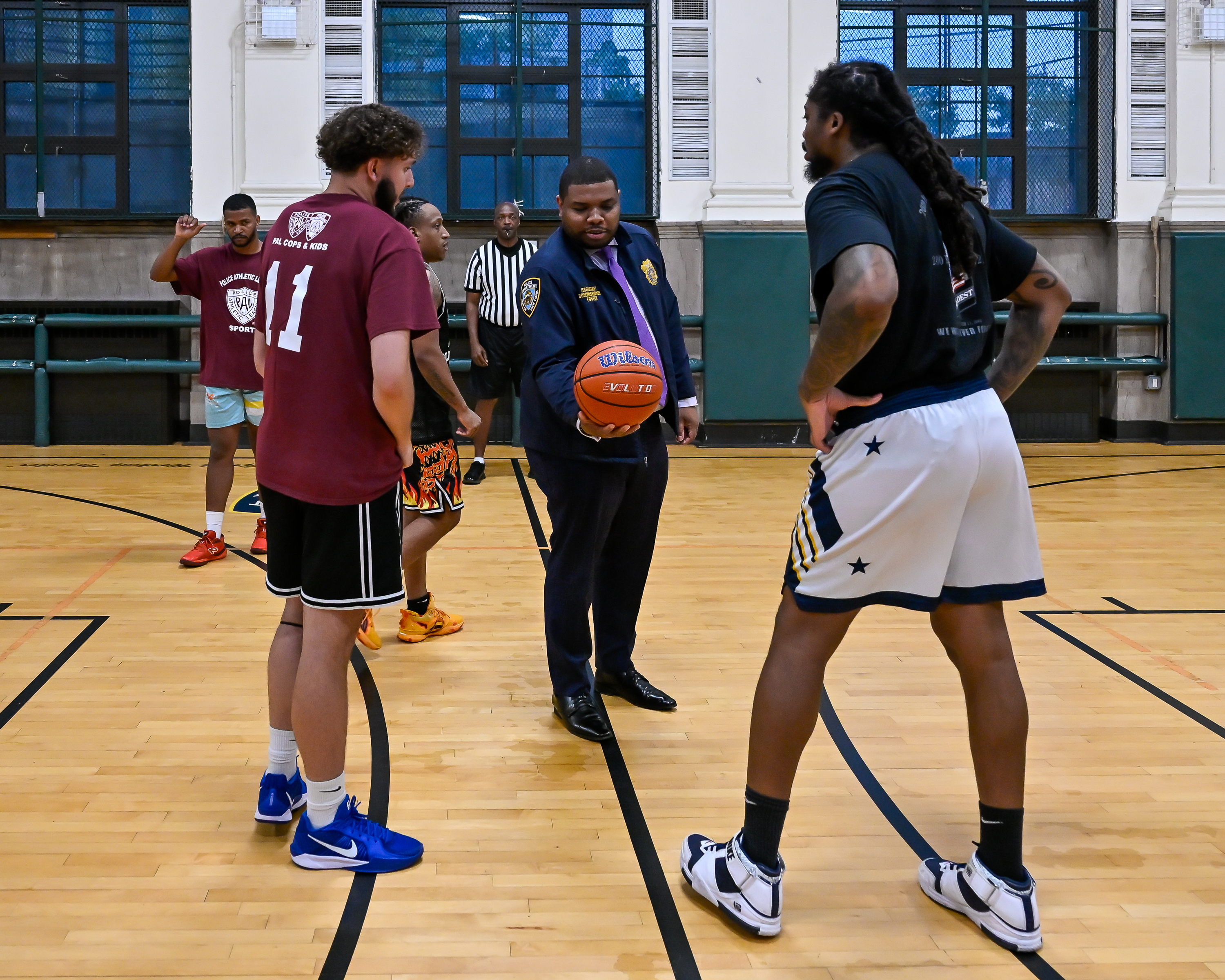 On the brink of a clean sweep: Deaf Community basketball team dominates NYPD on the court 2 Alden Foster tips off the game