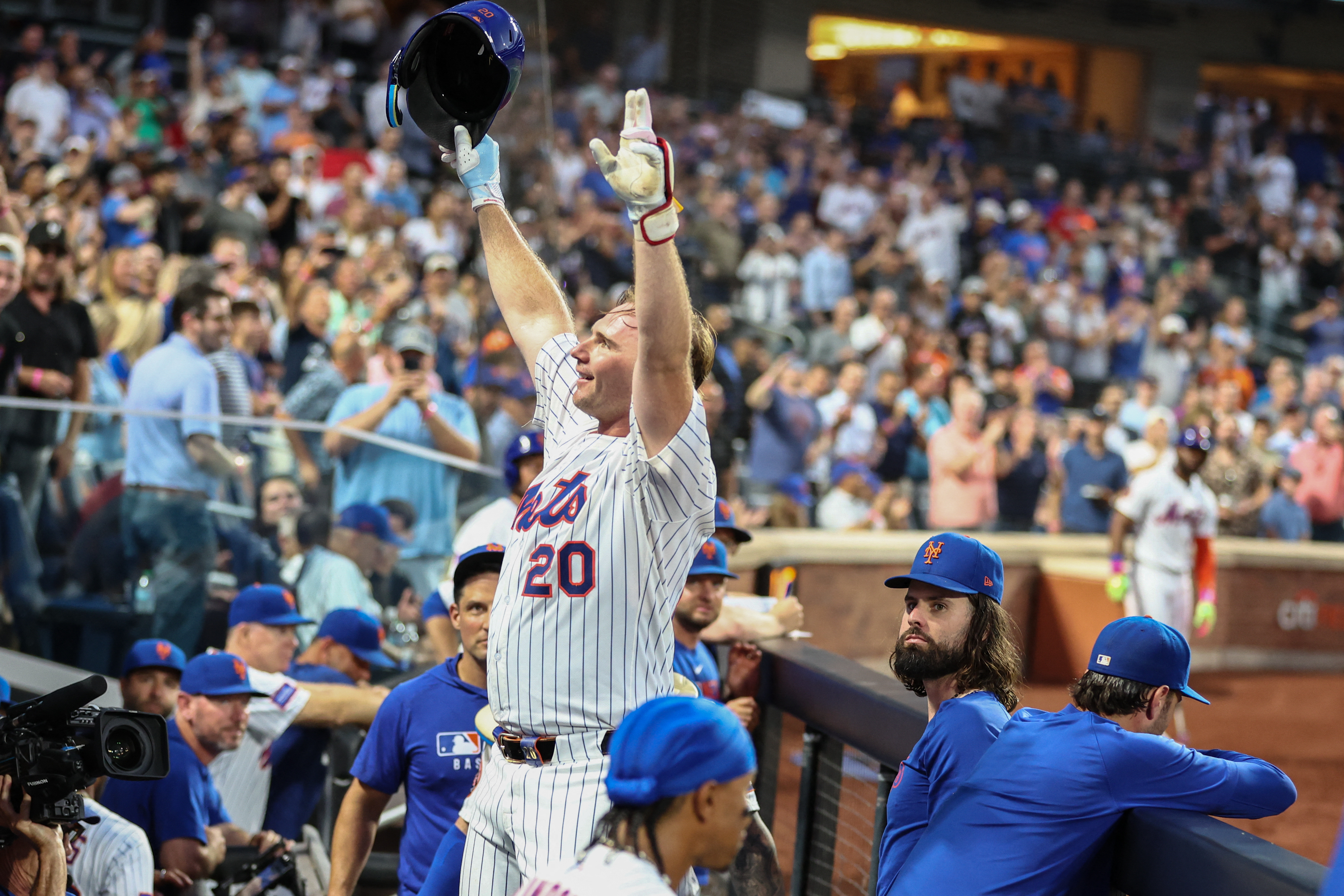 Pete Alonso on future with Mets: Steve Cohen and David Stearns 'gotta come through' 5 Pete Alonso 253 curtain call: Man in white uniform raises arms in celebration in baseball dugout