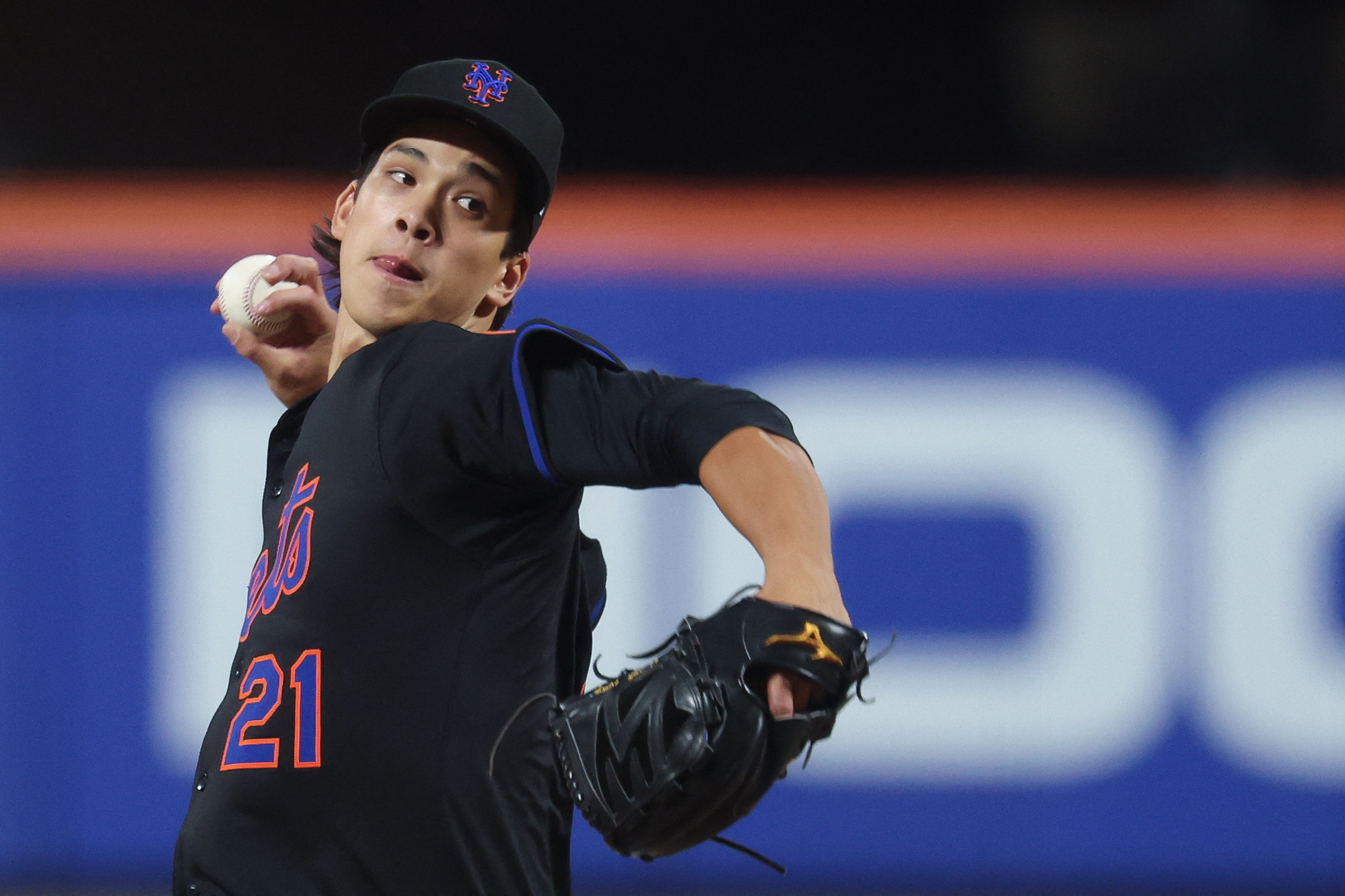 What could a Mets postseason rotation look like? 5 Jonah Tong Mets: Man in black uniform winds up to throw baseball