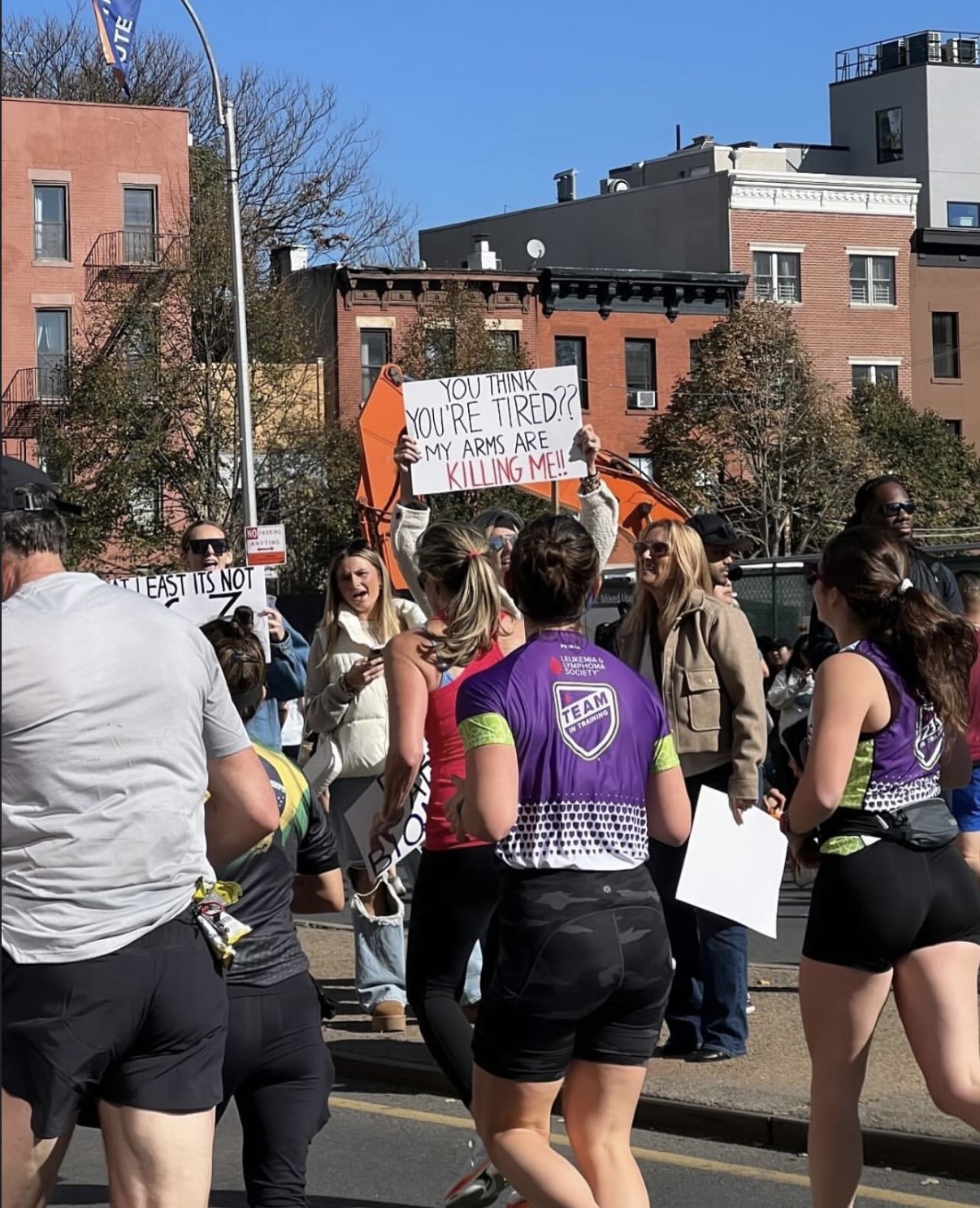 NYC MARATHON | The funniest NYC Marathon signs that could only exist here 5 the sign reads: you think you're tired? my arms are killing me!