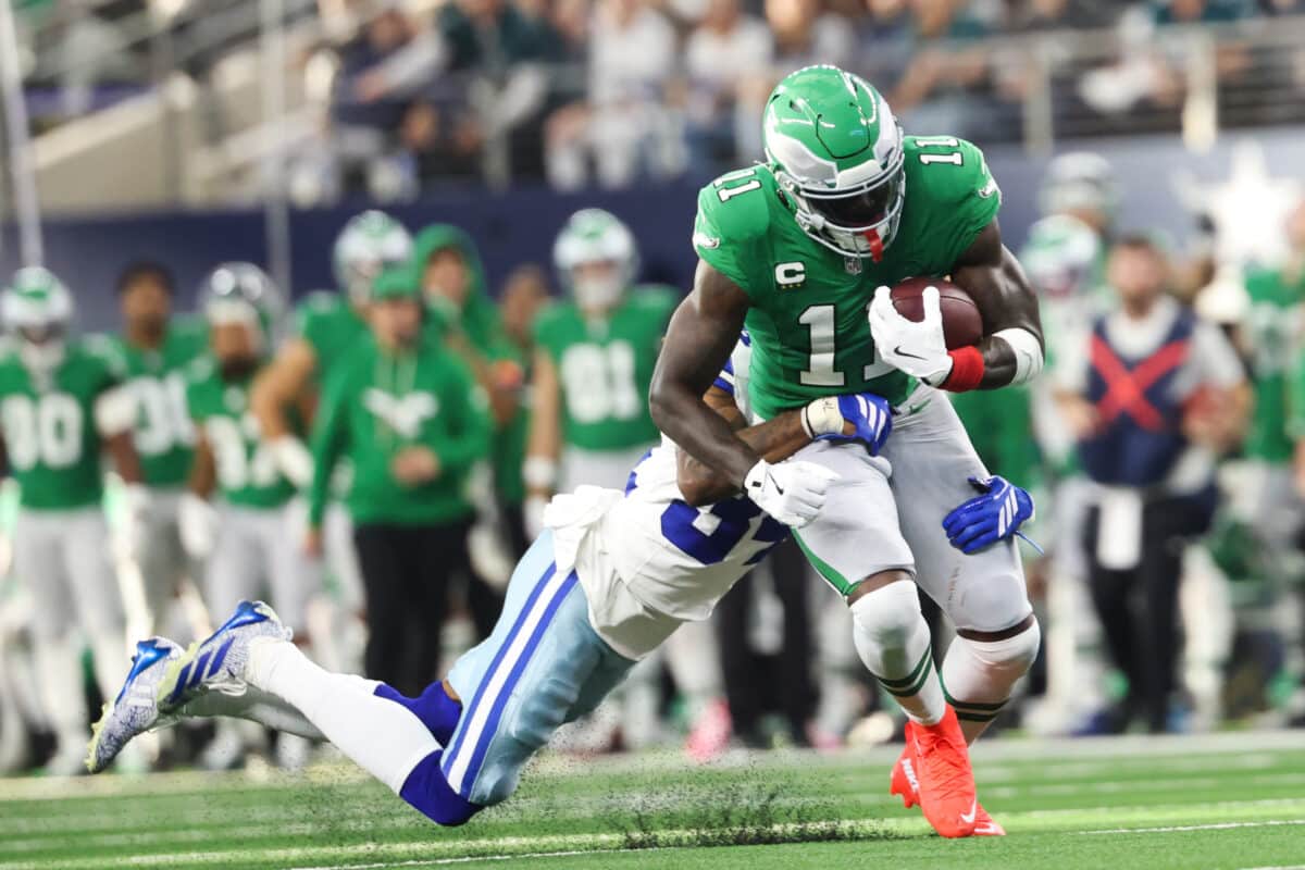 Philadelphia Eagles wide receiver AJ. Brown (11) is brought down by Dallas Cowboys cornerback Shavon Revel Jr. (34) in the first quarter at AT&T Stadium. Sign up with the DraftKings promo code to bet on Bears vs. Eagles.