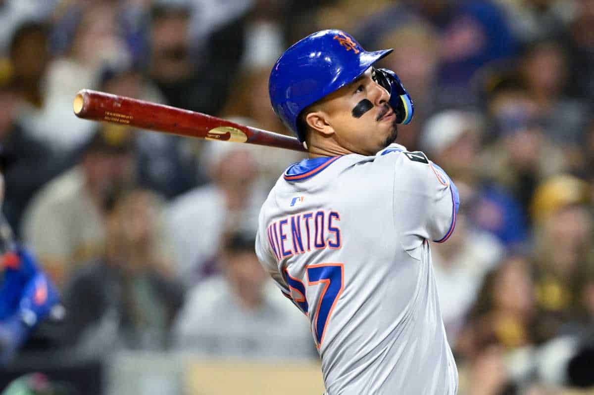 Mark Vientos Mets: Man in grey uniform wings baseball bat and watches ball